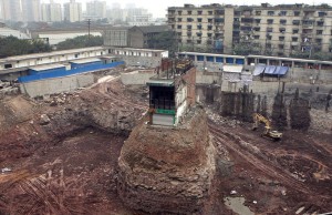 The home of Wu Yang, who refused to give up his home despite new development; 2004. Photo via: http://ow.ly/YxIaD